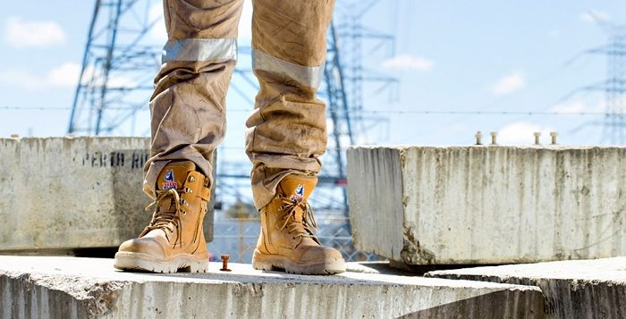 man at his workplace wearing Steel Blue safety boots