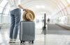 person next to a luggage