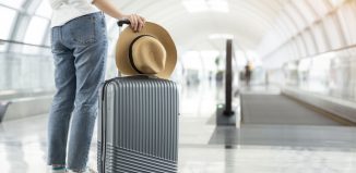 person next to a luggage