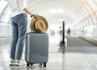 person next to a luggage