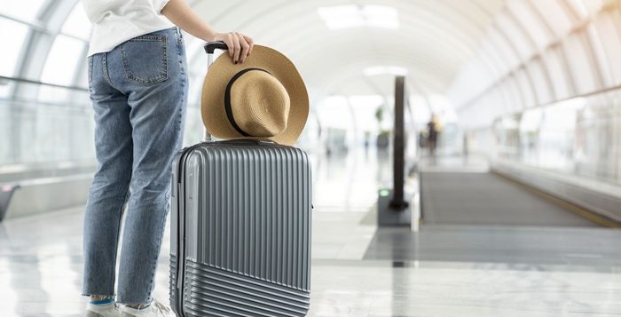 person next to a luggage